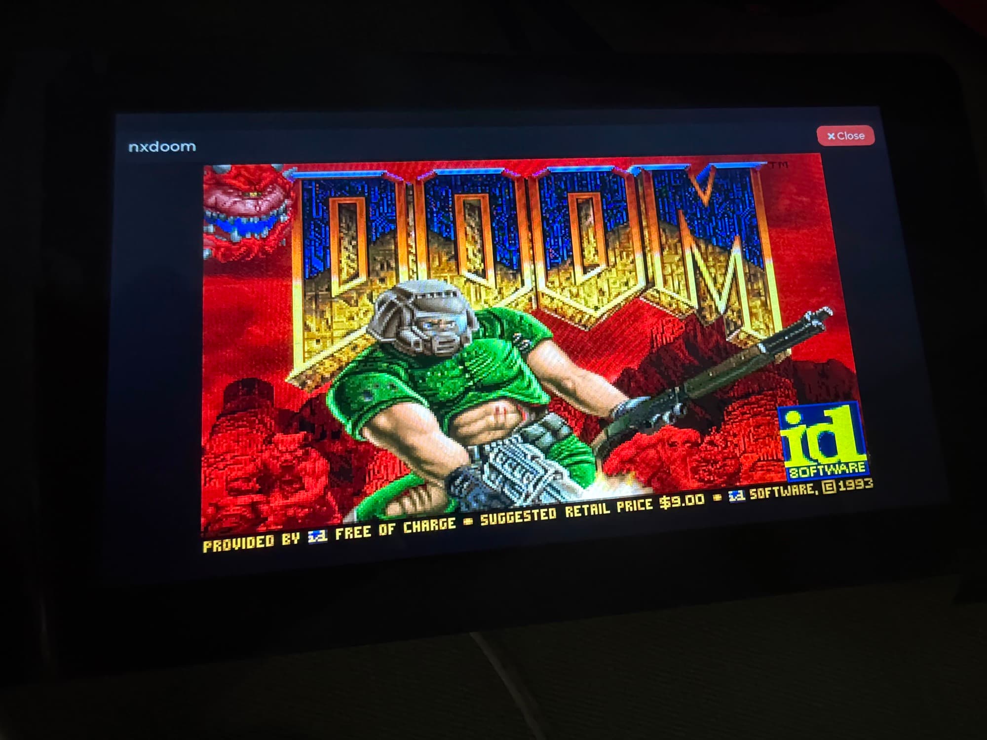 NXDoom title screen running as a supervised module on the ESP32-S3 touchscreen board