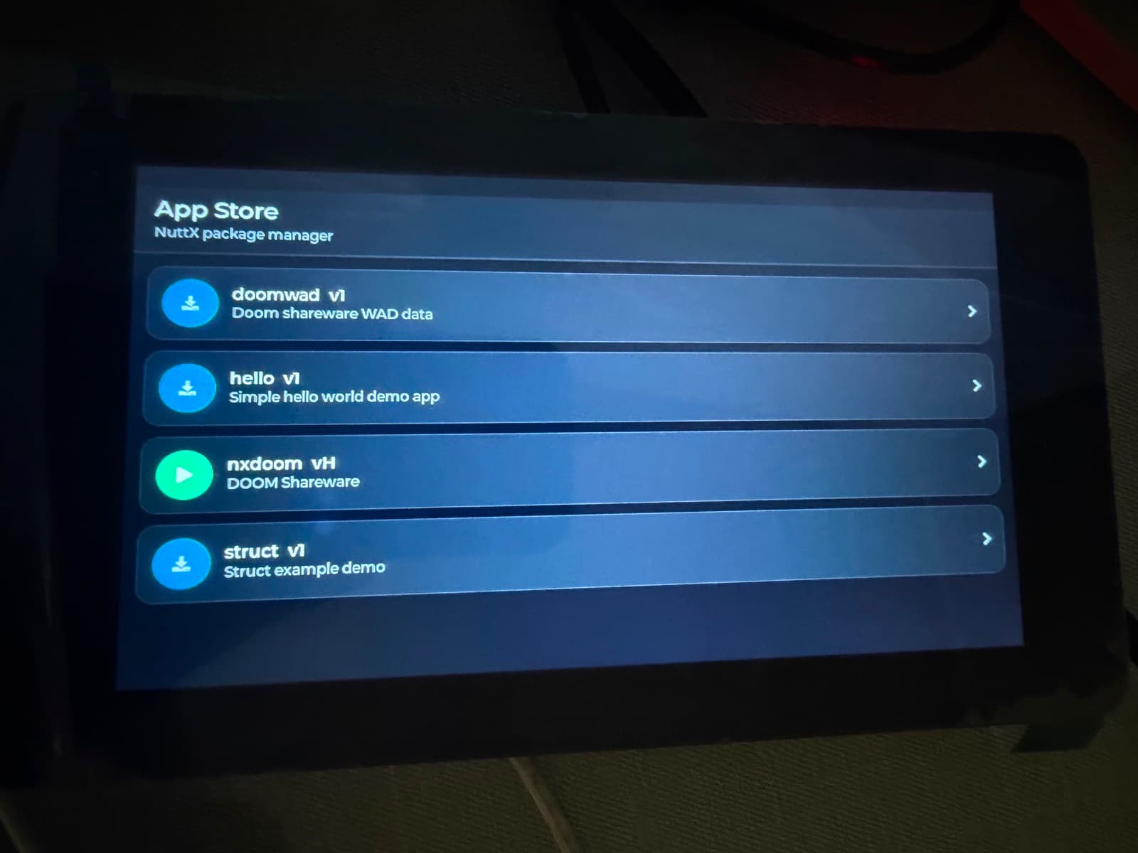 NXStore catalog running on an ESP32-S3 touchscreen board